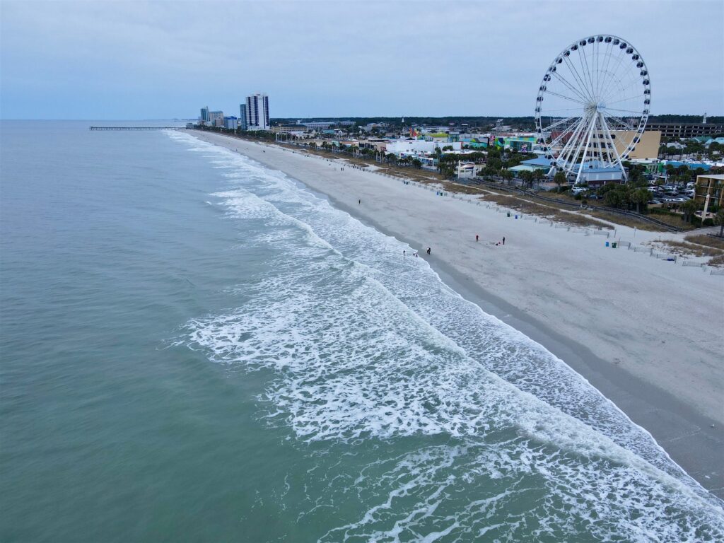 Aerial view of Myrtle Beach shoreline with the SkyWheel and boardwalk