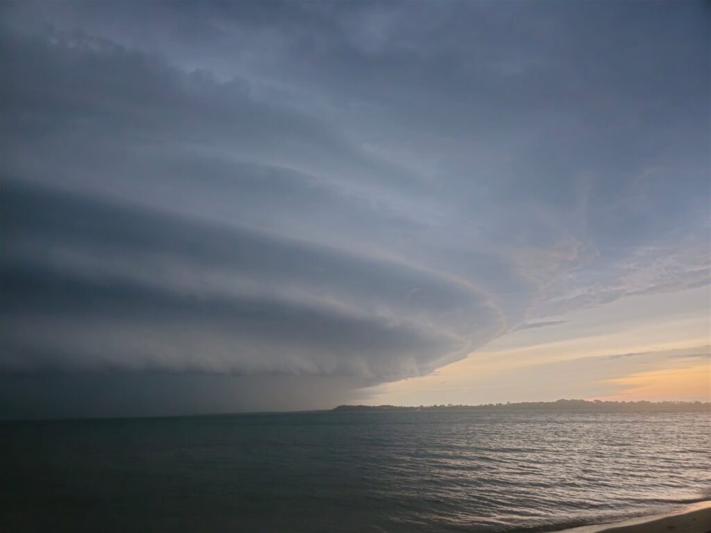 Dramatic storm clouds over the ocean at sunset along the South Carolina coast
