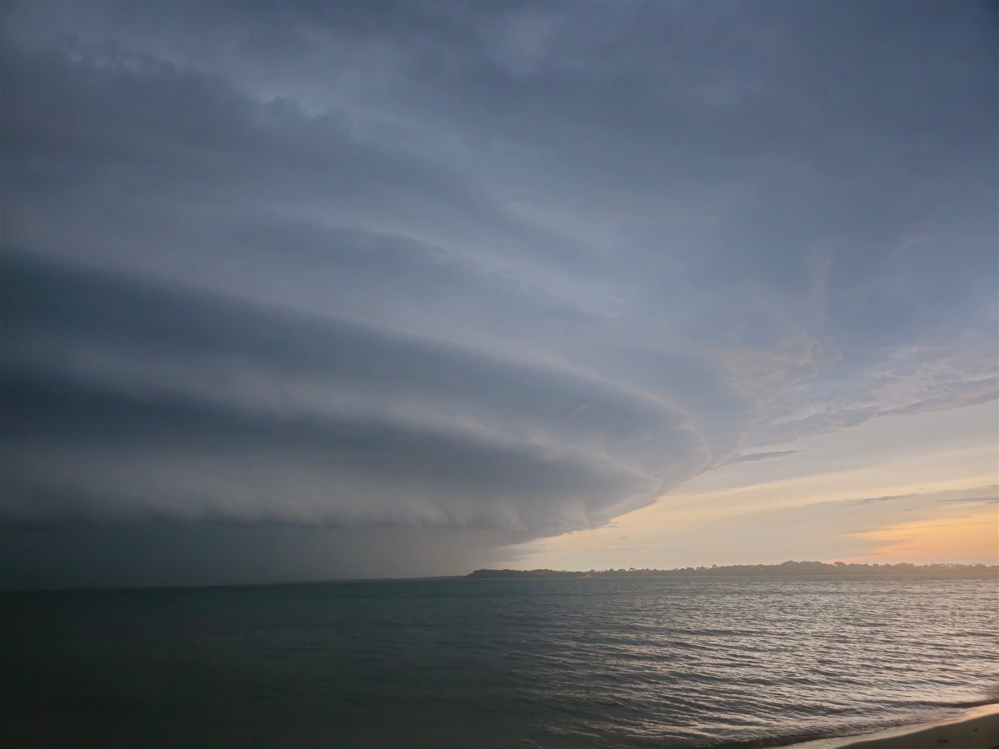 Dramatic storm clouds over the ocean at sunset along the South Carolina coast